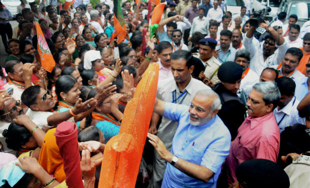 Modi waves to the crowd as he arrives at Panaji to attend BJP National Exicutive Meet in Goa