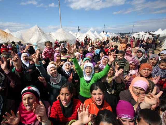 Syrian refugees protest against President Bashar al-Assad