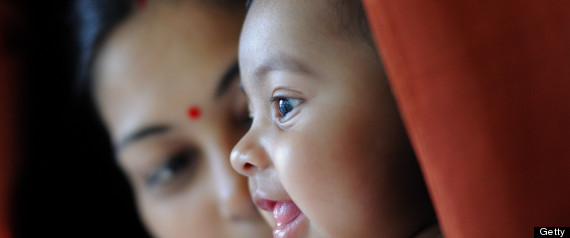 Baby girl with mother smiling