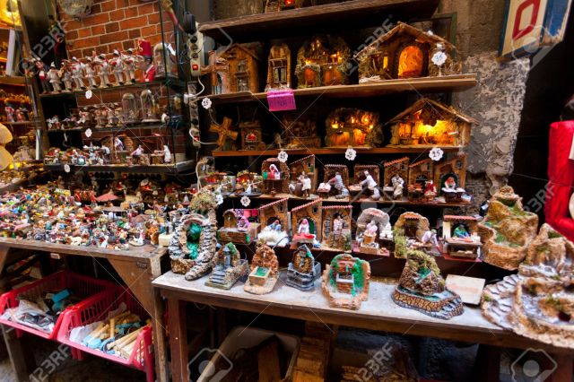 NAPLES, ITALY, OCTOBER 19: historic street "San Gregorio Armeno" of the old town of nativity scenes with puppets of famous people in Naples on 19 october 2013.